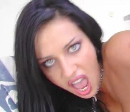 Close crop of a woman looking directly toward the camera.